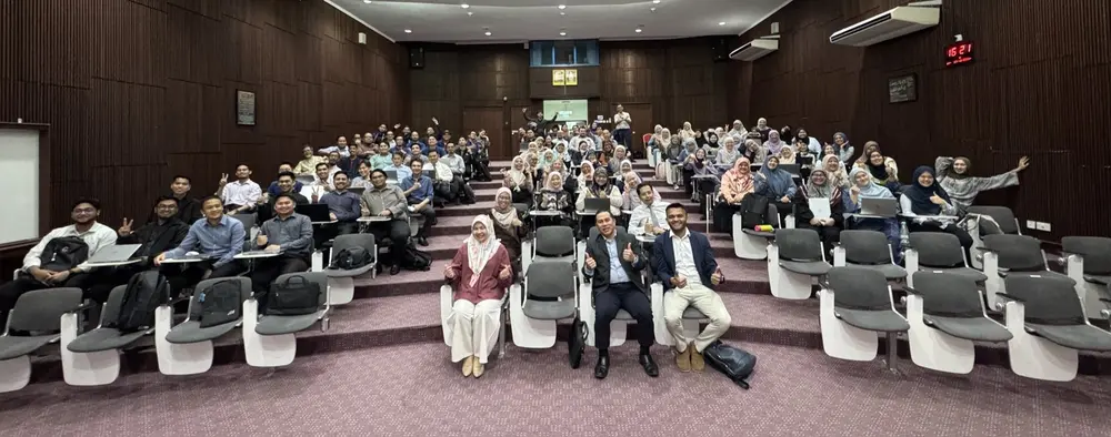 A full auditorium at a corporate AI session in Malaysia