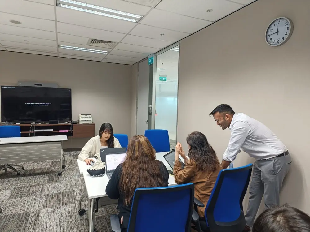 Participants working on their own laptops in Singapore